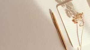 Notebook and pen in soft light representing clear, high-quality marketing translation content
