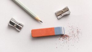 Pencil, eraser and shavings on a clean background representing editing and refining marketing translation content