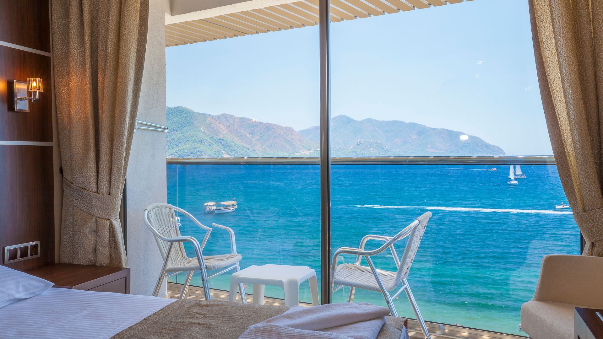 Hotel room with sea view balcony illustrating how tourism translation creates appealing experiences for international visitors