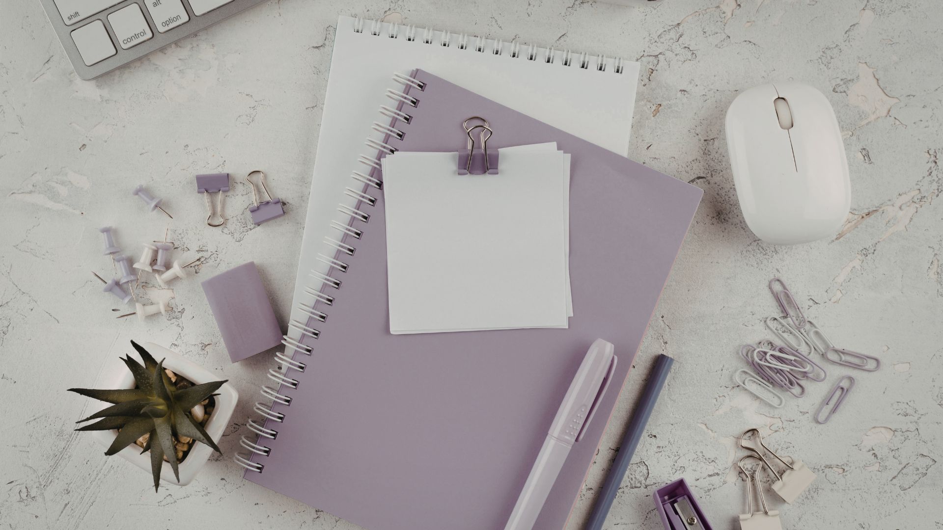Notebook and stationery representing the preparation of a translation project brief before starting a translation
